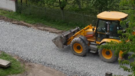 excavator carries gravel in the bucket