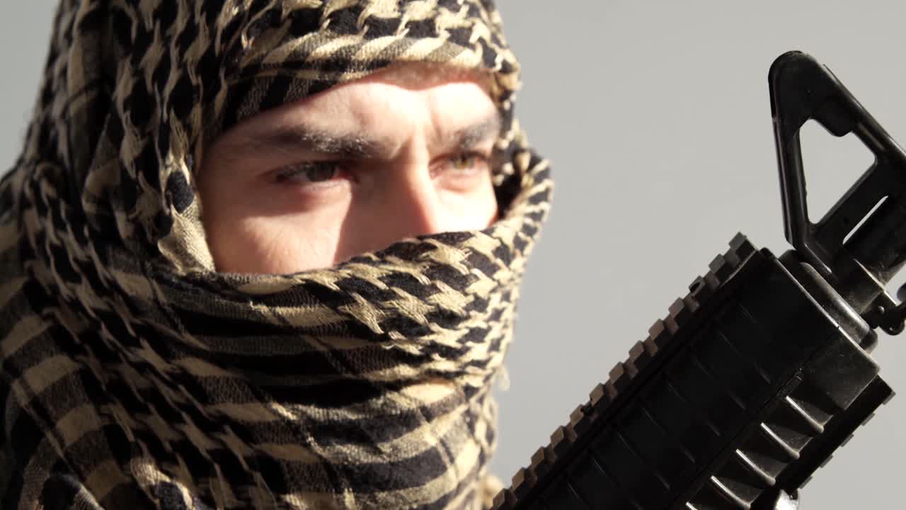 Portrait of soldier holding rifle