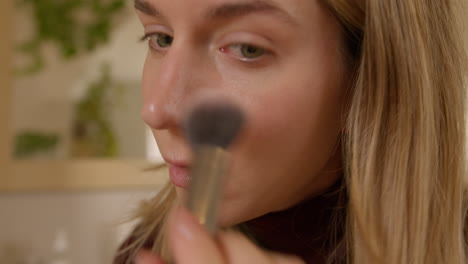 Girl-doing-makeup-on-herself-at-home