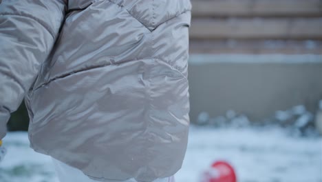 grandfather and granddaughter having fun in the snow