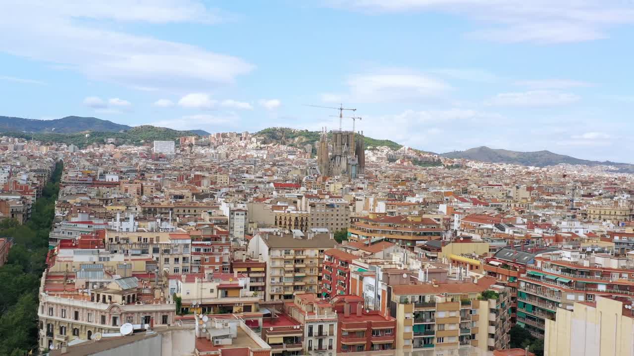 Barcelona City Downtown Sunny Drone Flying toward La Sagrada Familia