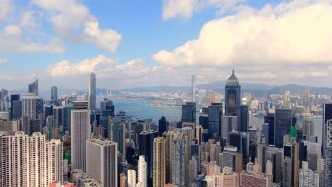 hong kong skyline and skyscrapers overlooking victoria bay on a beautiful day