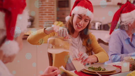 animación de nieve cayendo sobre una familia caucásica sonriente con sombreros de santa cenando