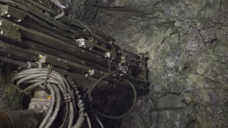 professional equipment drills holes in rocks of ore mine