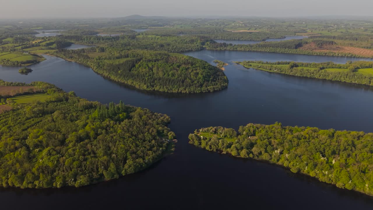 Lough oughter, surrounded by lush greenery in county cavan, ireland, aerial view