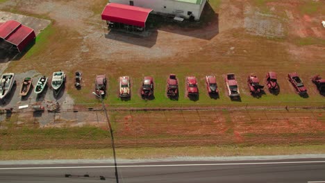 Lateral-Shot-Of-Old-Vintage-Cars-Buried-Near-Highway