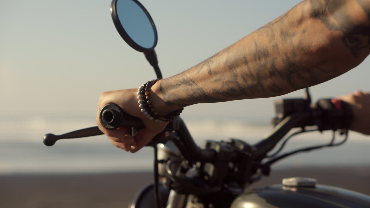 Man riding a motorcycle on the beach