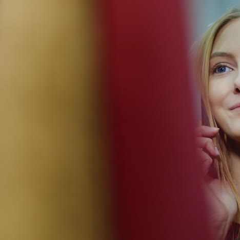 young woman chooses a dress in a store 4