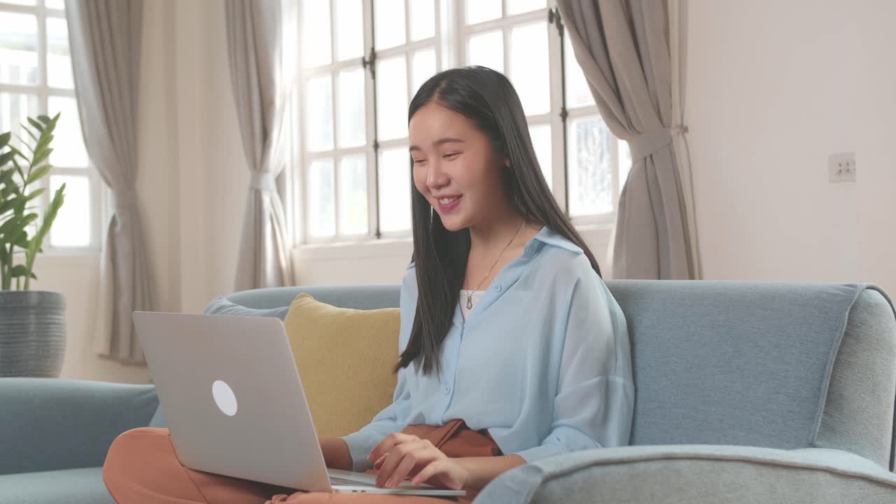 Asian Woman Video Conference Call From Laptop At Living Room, Video In 4K