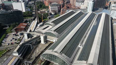 aerial drone flight over piccadilly train station in manchester city centre