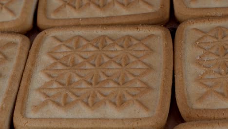 square crispy butter cookies detailed textured surface rotation.