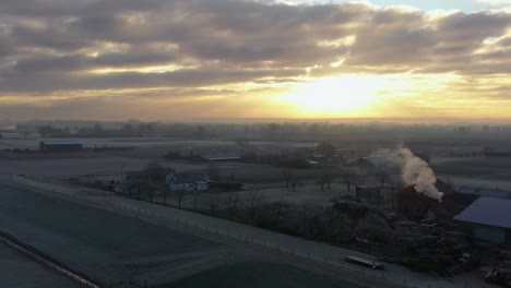 farmland sunrise drone shot with winter morning dew, netherlands farmland