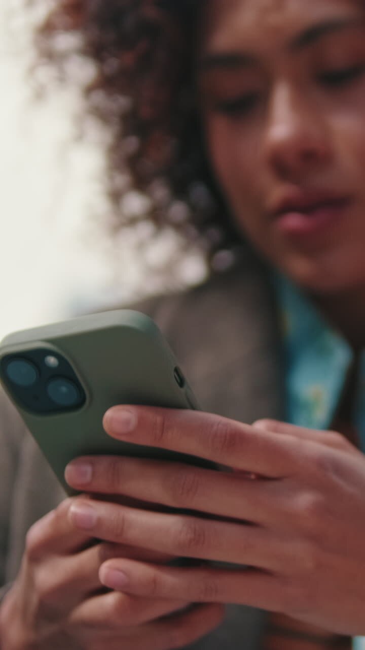 Woman Using Smartphone App Outdoors
