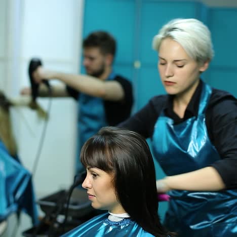 professional stylist working with client