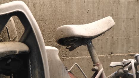 abandoned bike saddle left leaning on a sandy