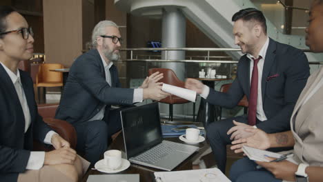 business team meeting in hotel cafe