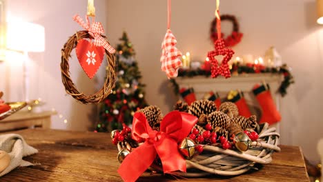 Grapevine-wreath-with-red-ribbon-and-pine-cone