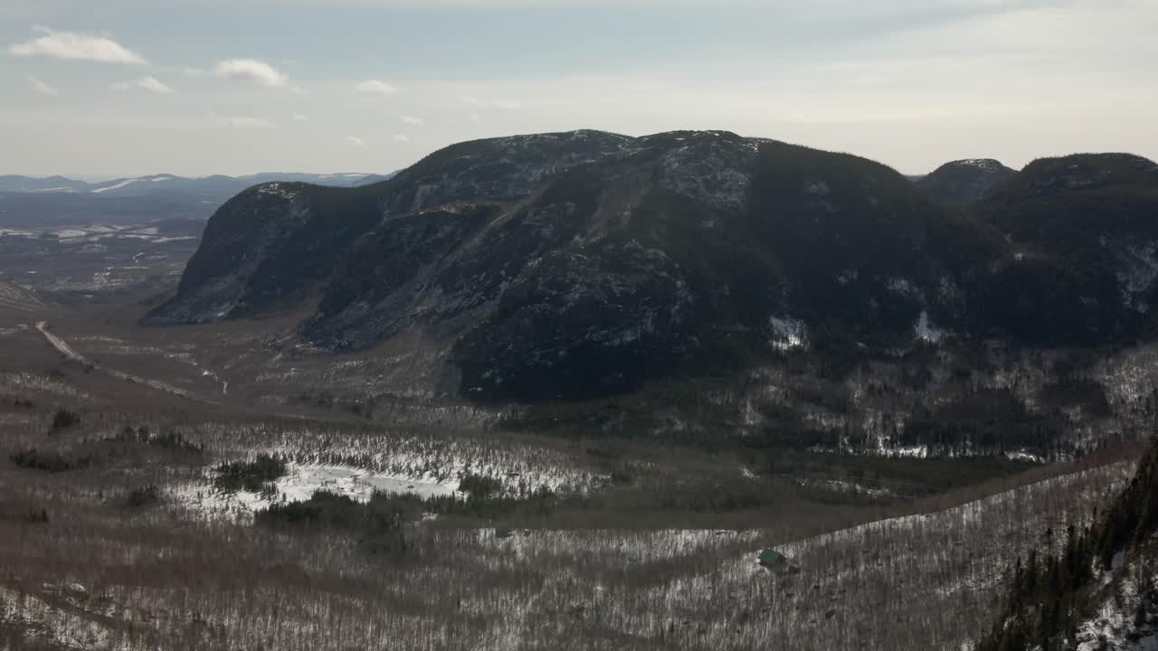 Mountainous Dome During Hazy Morning With Freezing Lake In Middle At Mont du Dome In Quebec, Canada