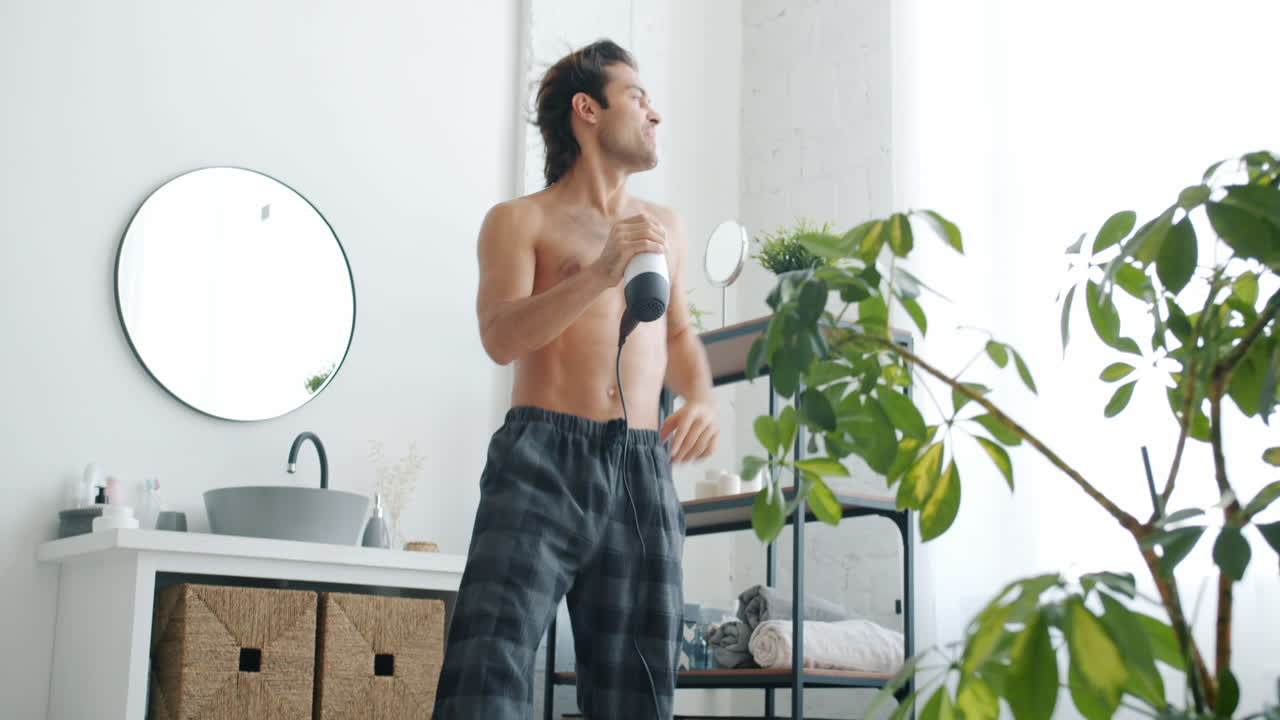 Man Singing and Dancing in Bathroom