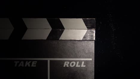 clapperboard with water droplets