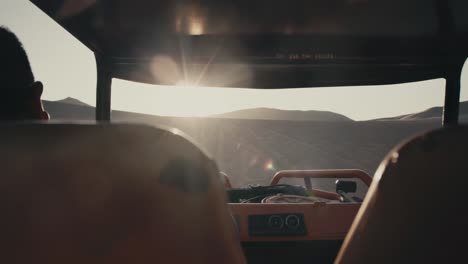 desert adventure: dune buggy ride at sunset