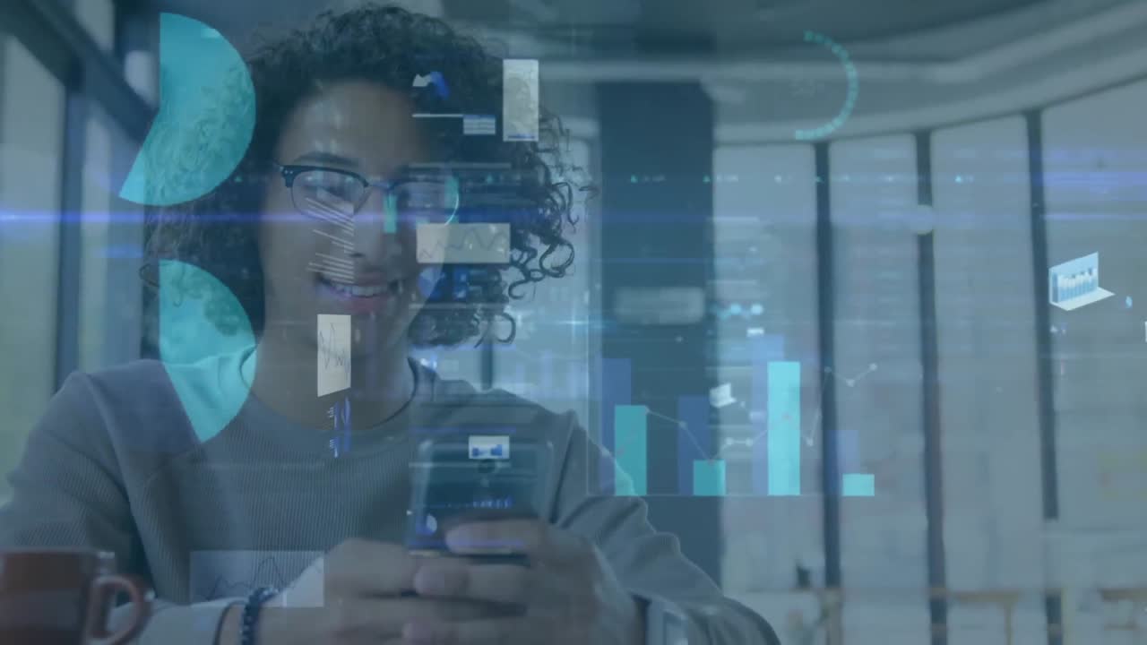 Animation of multiple graphs, trading board, loading circles, smiling biracial man using cellphone