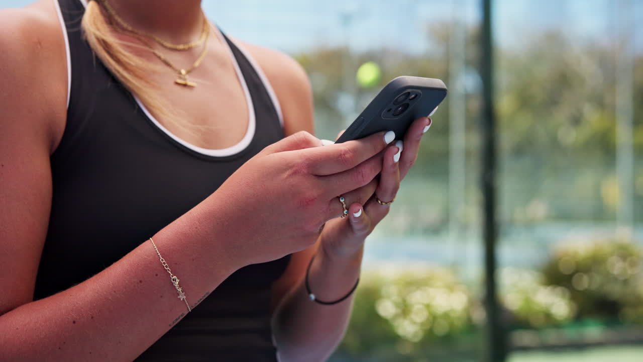 Close-up of Woman's Hands Typing on Smartphone Outdoors