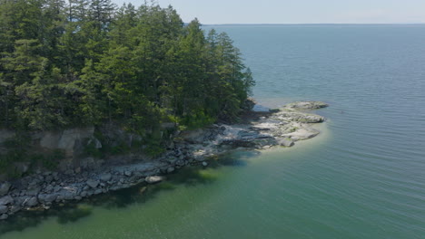 aerial pan of a tiny island in puget sound near bellingham, washington