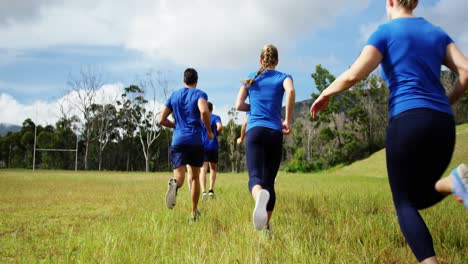 fit people jogging in boot camp 4k