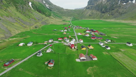 Cinematic-aerial-shot-over-Unstad-beach-houses,-Vestvagoy,-Lofoten-Islands,-Norway