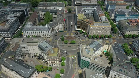 flight over sunny day geneva city lakeside fountain traffic street circle aerial panorama 4k switzerland