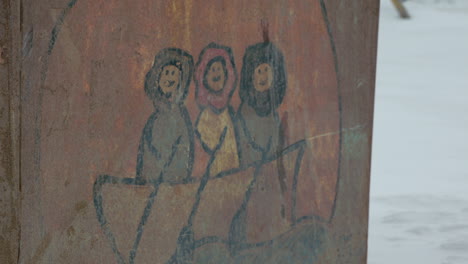 Closeup on I&ntilde;upiat artwork on Dumpster at Utqiagvik Barrow Alaska
