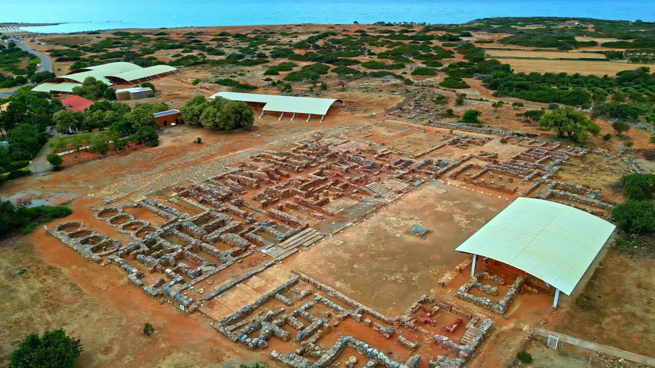 Panoramic drone shot circling the ruins of the Palace of Knossos in Crete, Greece