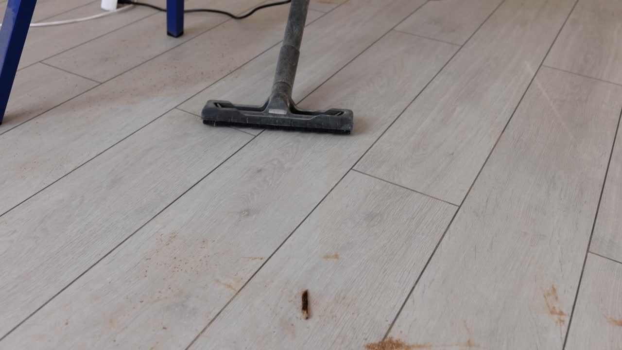 Vacuuming a hardwood floor