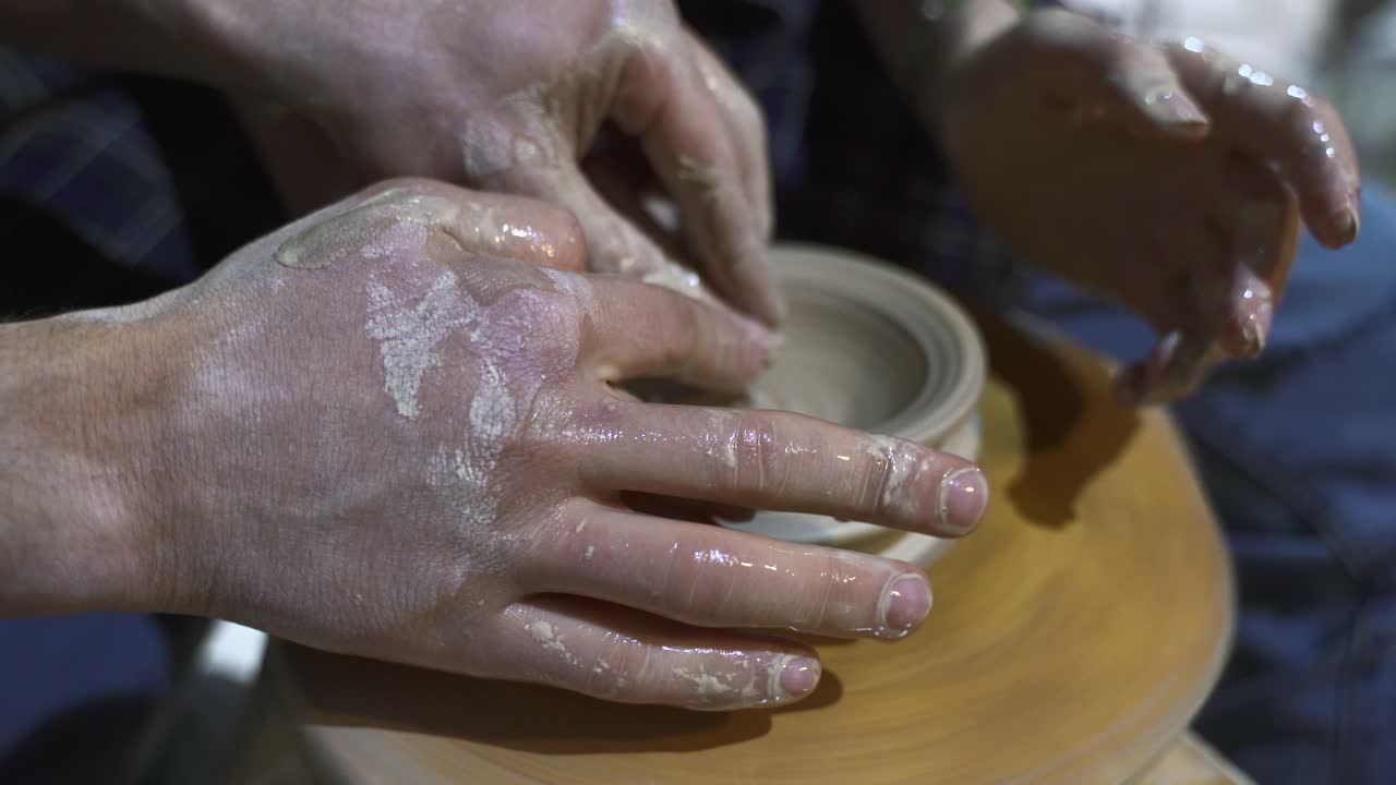 Pottery Workshop: Hands Shaping Clay on a Wheel