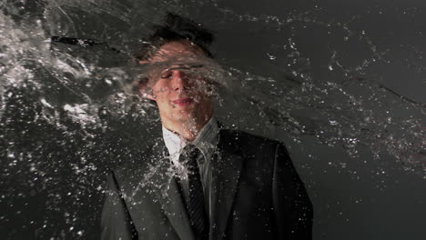 Man-in-suit-being-splashed-with-water