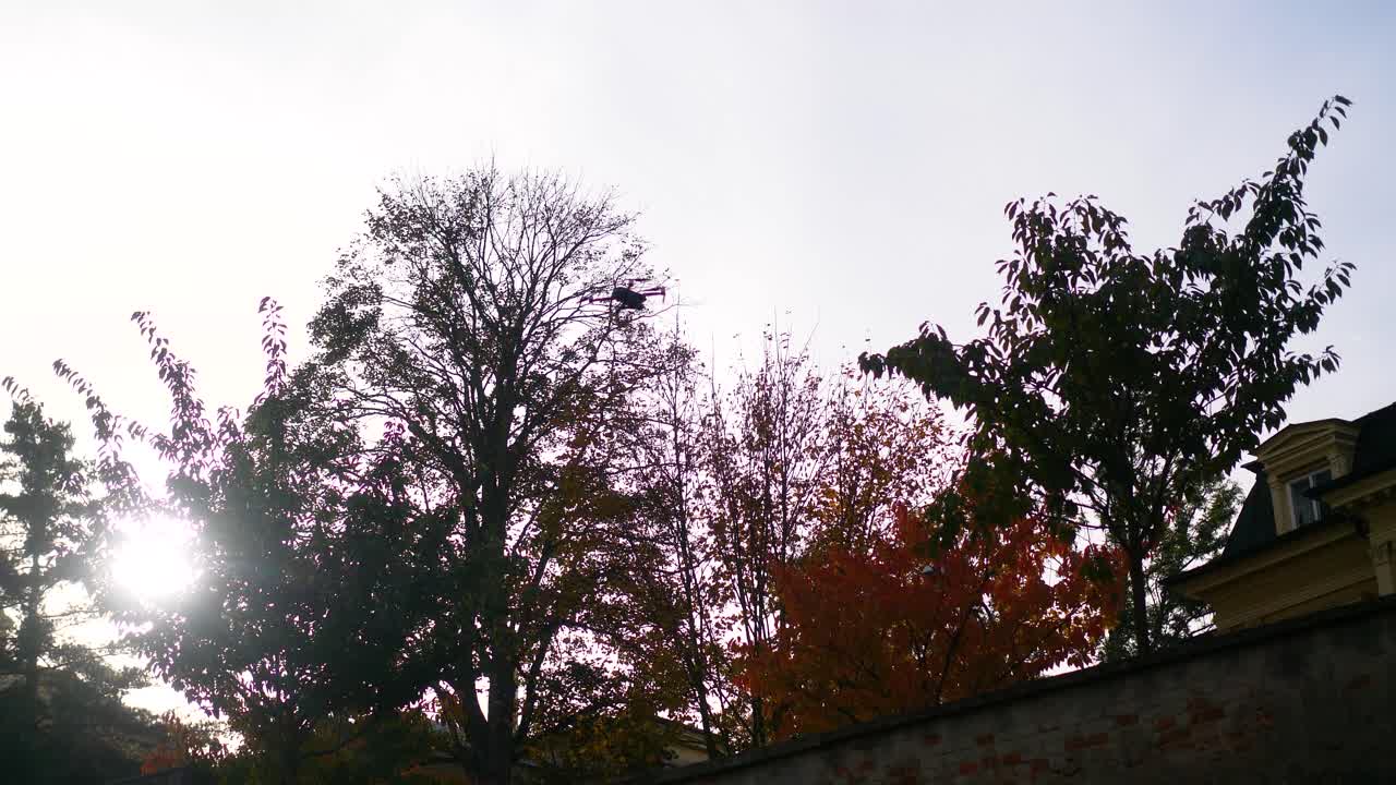 Small drone flying in the air, recording beautiful shots of a city