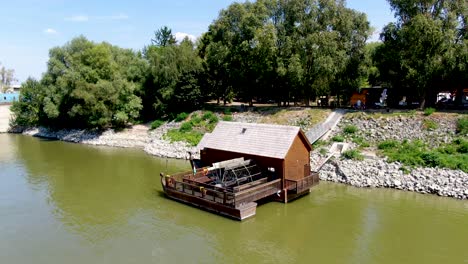 historic ship with watermill on the danube river in baja, hungary
