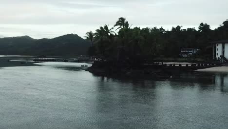 drone footage over calm ocean coral coast fiji island beach hotel resort