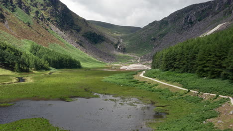 aerial shot of upper glendalough lake and mountains in wicklow national park