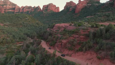 scenic view of nature landscape with vehicles on dirt road near sedona, arizona usa