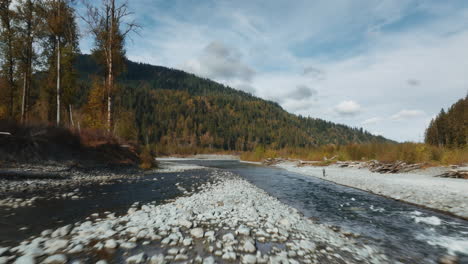 drone flight over beautiful rocky mountain river in washington state, usa