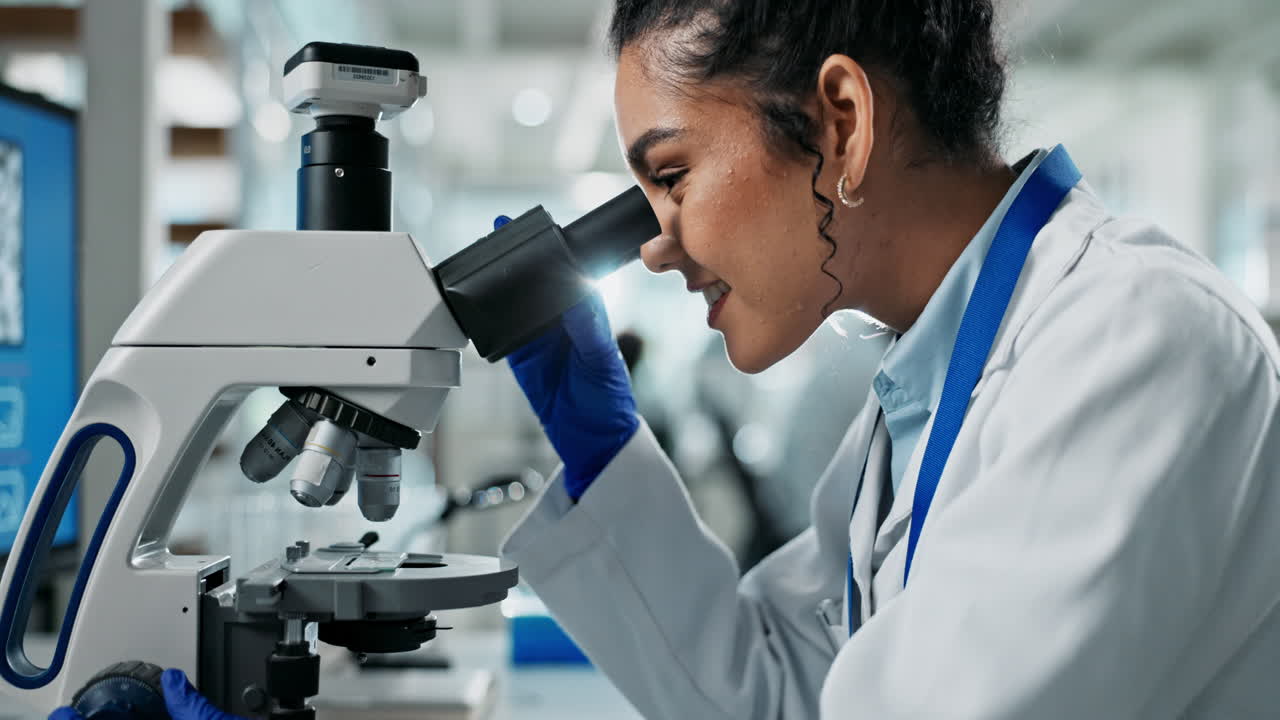 Scientist using a microscope in a laboratory