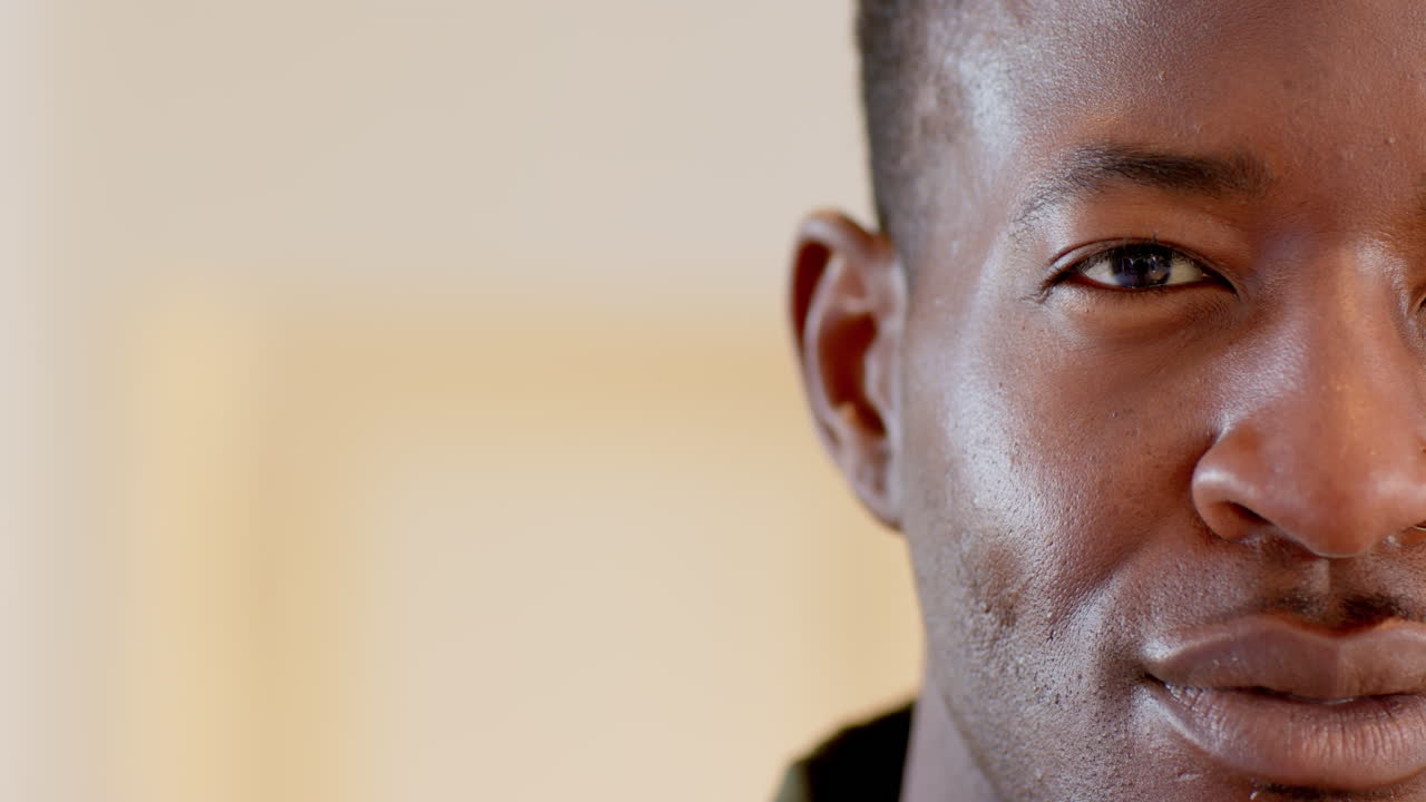 Close-up of man smiling warmly, capturing joyful holiday spirit at home, copy space
