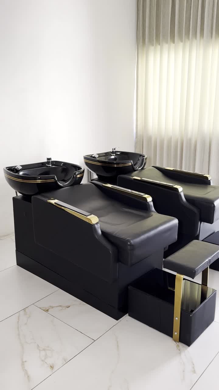 Hairdressing chair and sink. Luxury beauty salon, vertical shot
