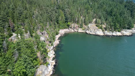 Aerial-view-of-Starboat-Cove-coastline,-Lighthouse-Park,-BC,-Canada