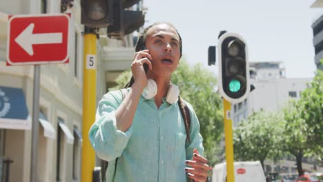 mixed race man talking on the phone