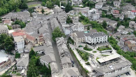 drone view in albania flying in gjirokaster over a medieval town showing the brick brown roof houses