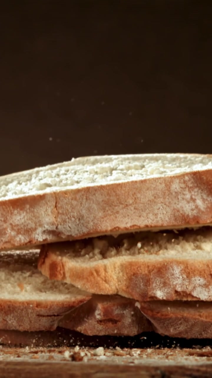 Freshly Baked Bread Slices Falling and Stacking in Slow Motion