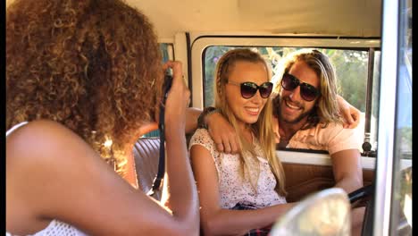 woman taking picture of friends